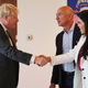 British Prime Minister Boris Johnson greets Amazon founder Jeff Bezos and his girlfriend, Lauren Sanchez, at the UK diplomatic residence on September 20, 2021 in New York City.